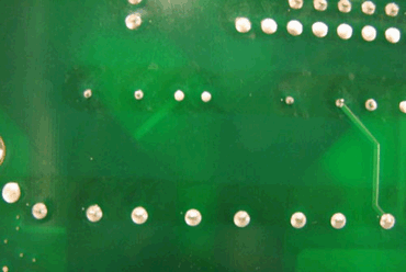 Figure 1: Dark stripes on the solder mask after selective soldering Figure 1: Dark stripes on the solder mask after selective soldering